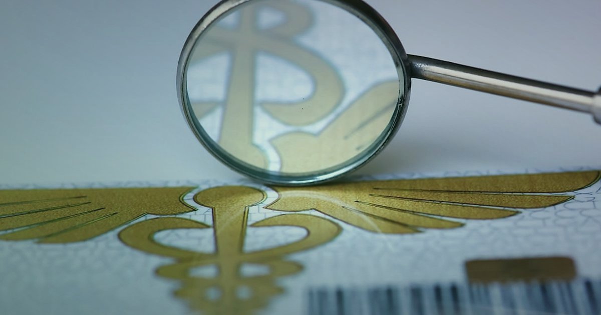 Kablolu Kulaklık Tedarikçisi Bulma: 2026'da Güvenilirlik Kontrolü ve Doğrulama Rehberi - magnifying glass examining a company logo on a document