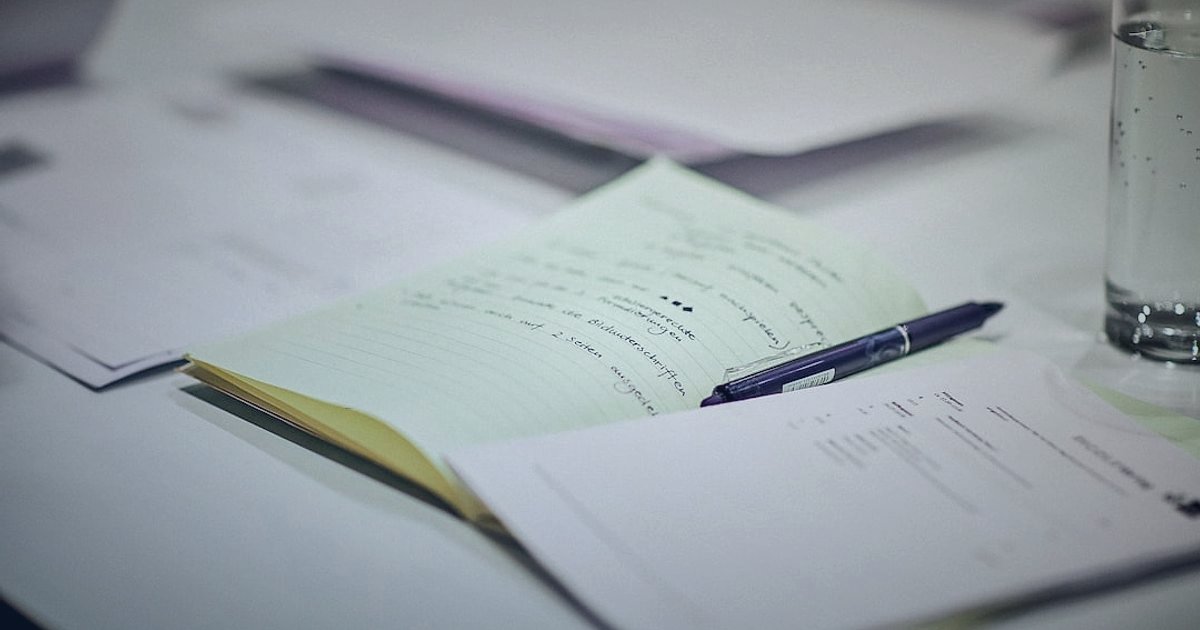 N11 Mağaza Açma Rehberi 2026: Adım Adım Satışlarınızı Patlatın! - documents spread out on desk with pen