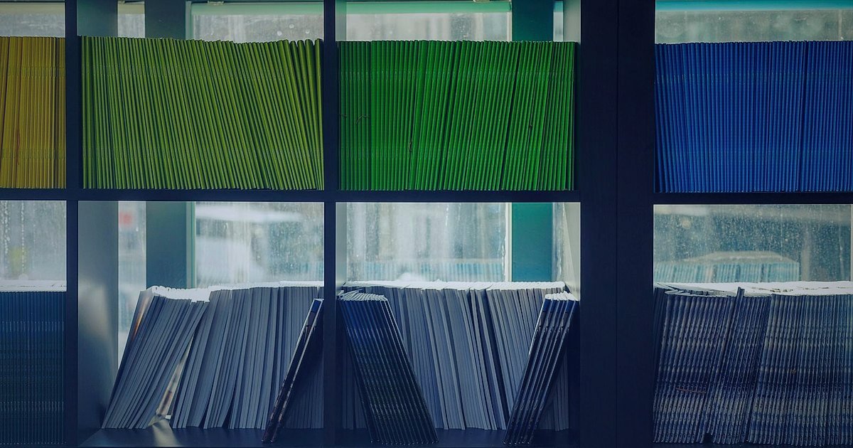 Pazaryeri Ürün Listeleme 2026: Satışları Katlayan İpuçları - librarian organizing books on shelves with color coded labels